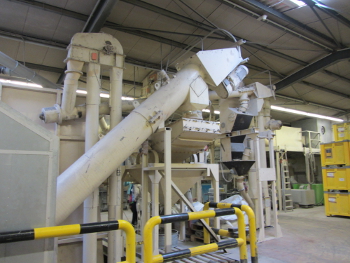 A hammer mill and a sieving machine separate the PVC from glue and concrete residues.